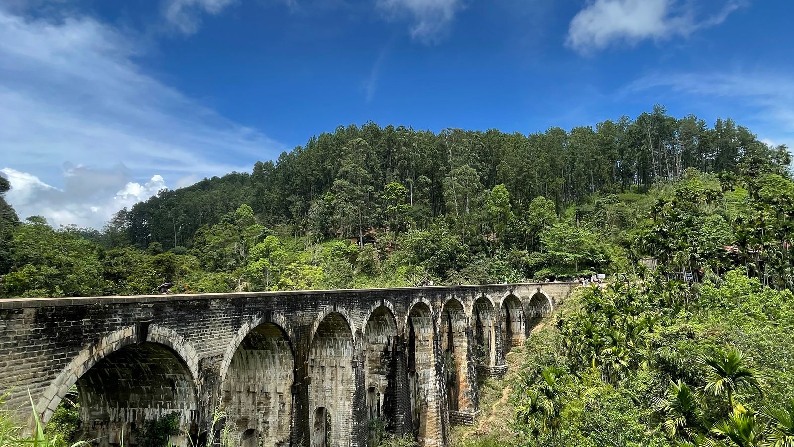 Nine Arch Bridge surrounded by the forested hills of Ella