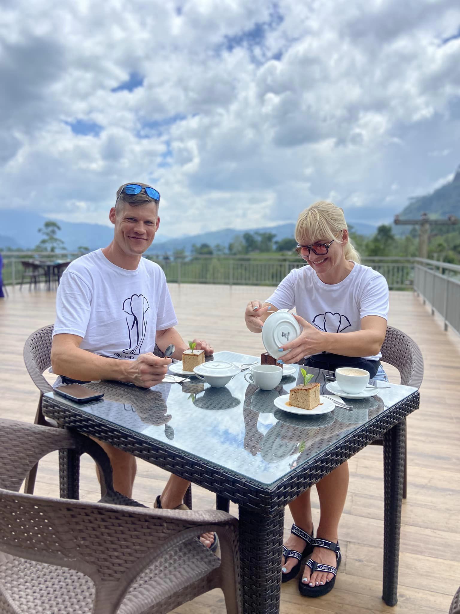 Visitors enjoying tea with a mountain view