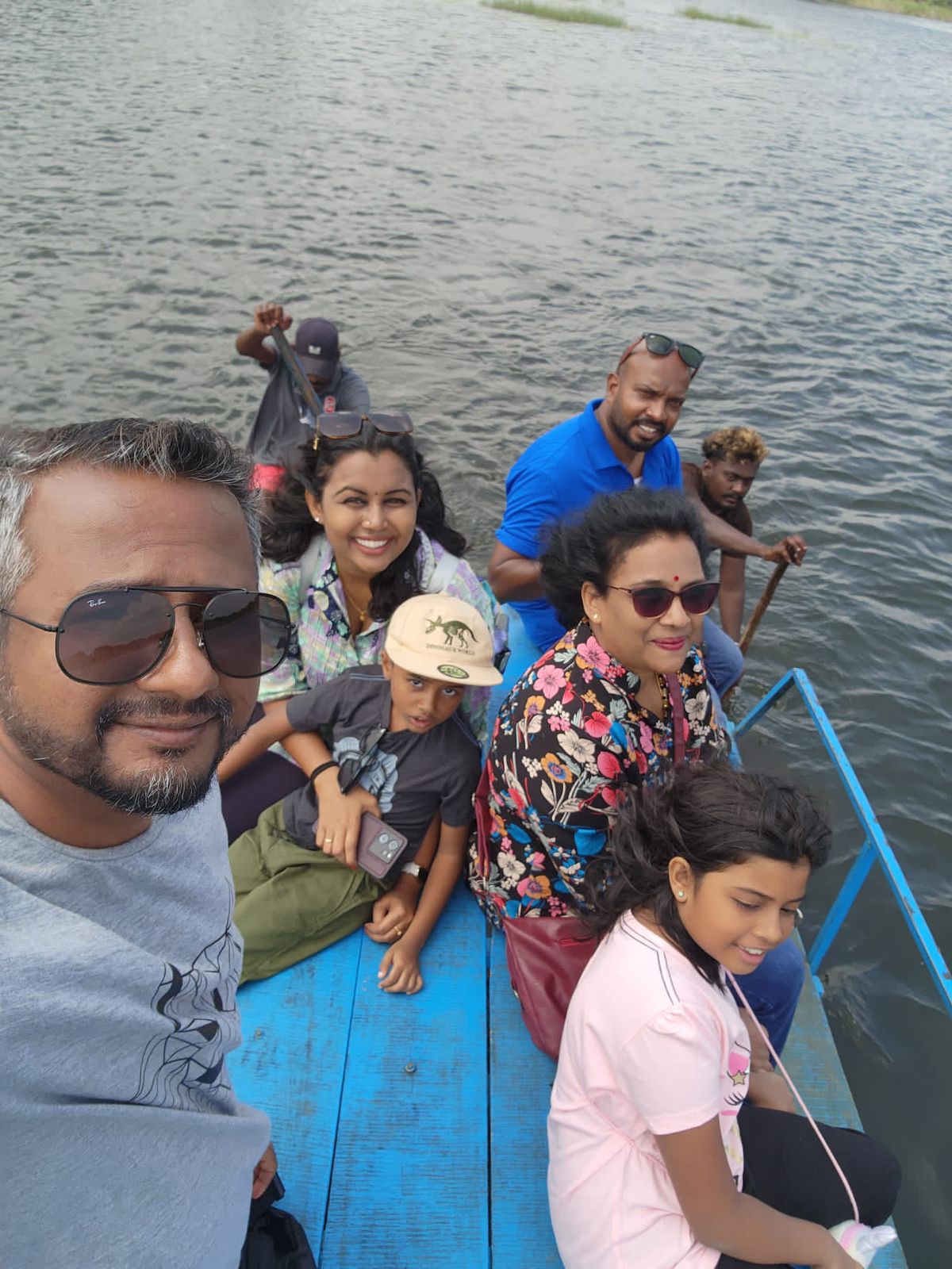 A group enjoying a boat ride on the water
