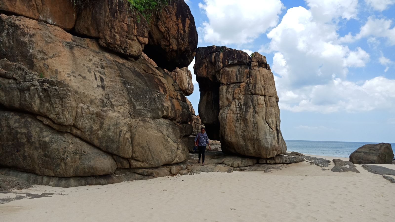 Rocky shoreline and sandy beach in Trincomalee